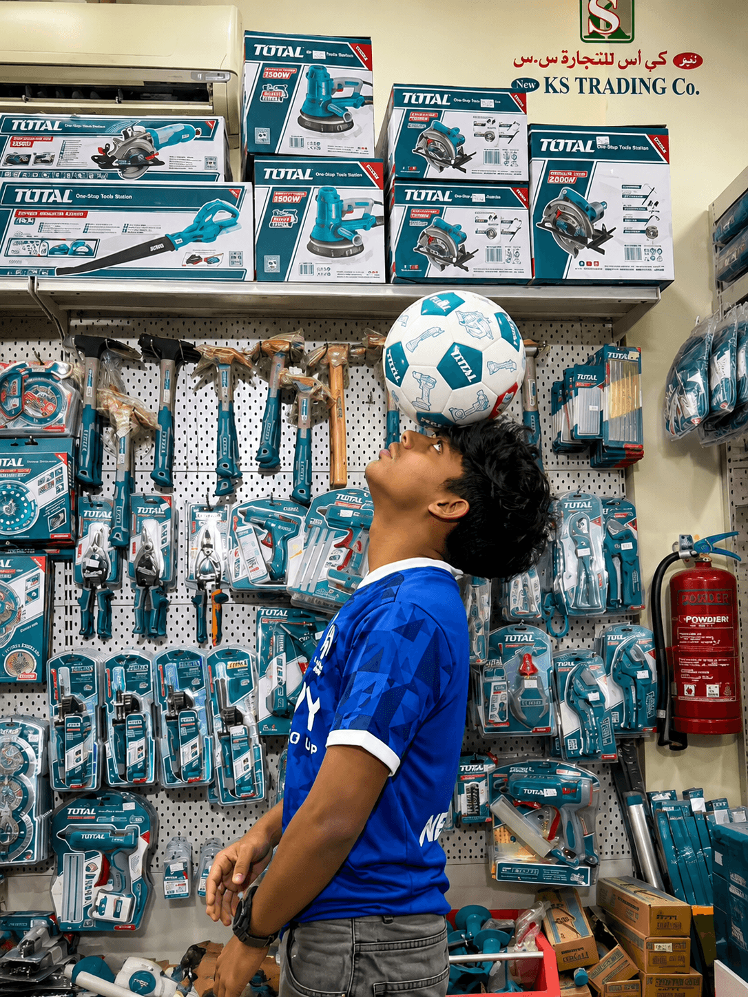 Sinan Basim freestyling with a ball inside a retail store for a product activation