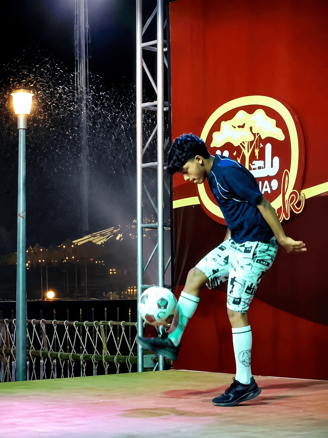 Sinan Basim freestyling on stage at a corporate event activation